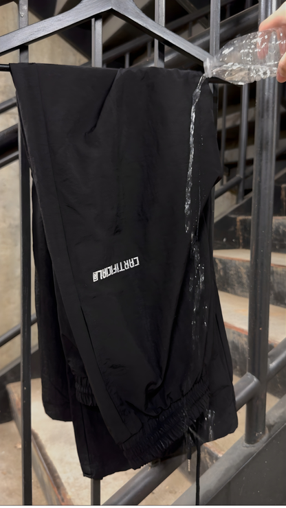 WATERPROOF BAGGY TRACK PANTS